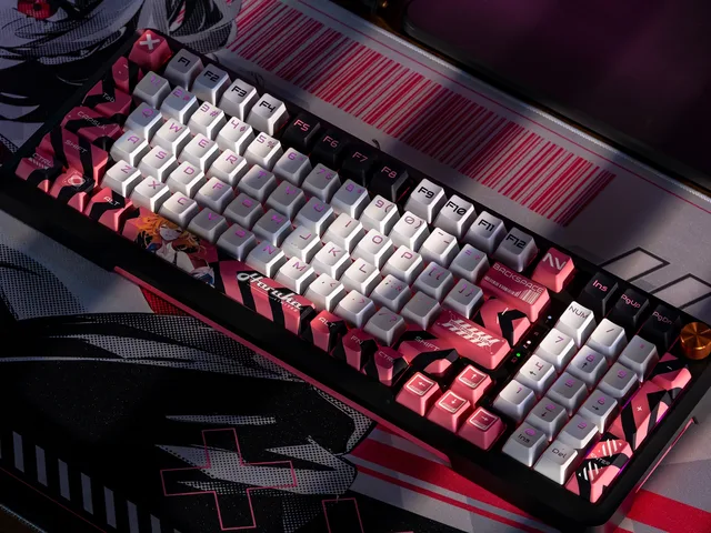 Close view of the Haruka original keyboard on a character mousepad under pink lighting