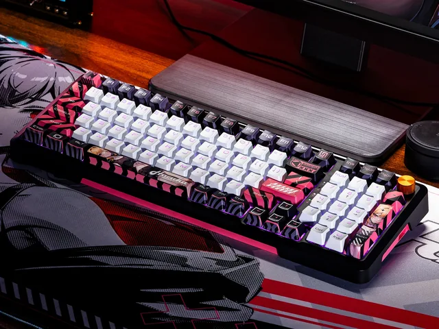TR98H 2.0 keyboard photographed on a desk with multicolor backlighting and a gold control knob