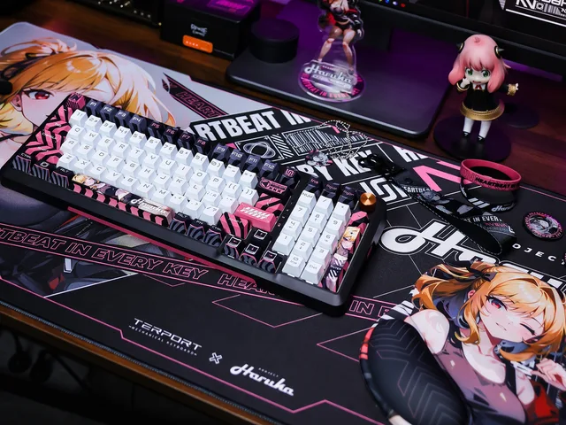 TR98H 2.0 keyboard on a Haruka mousepad beside an acrylic standee and character accessories