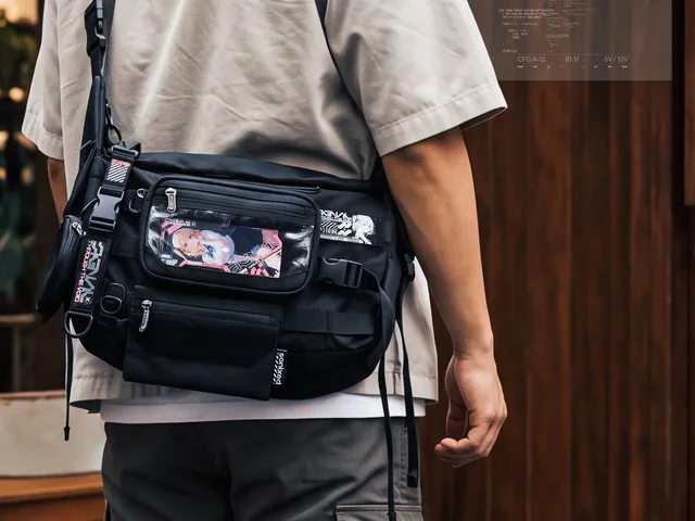 SONIXED carrier bag worn across the body with HITM character artwork and modular accessories